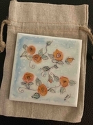 Single coaster with orange rosebuds